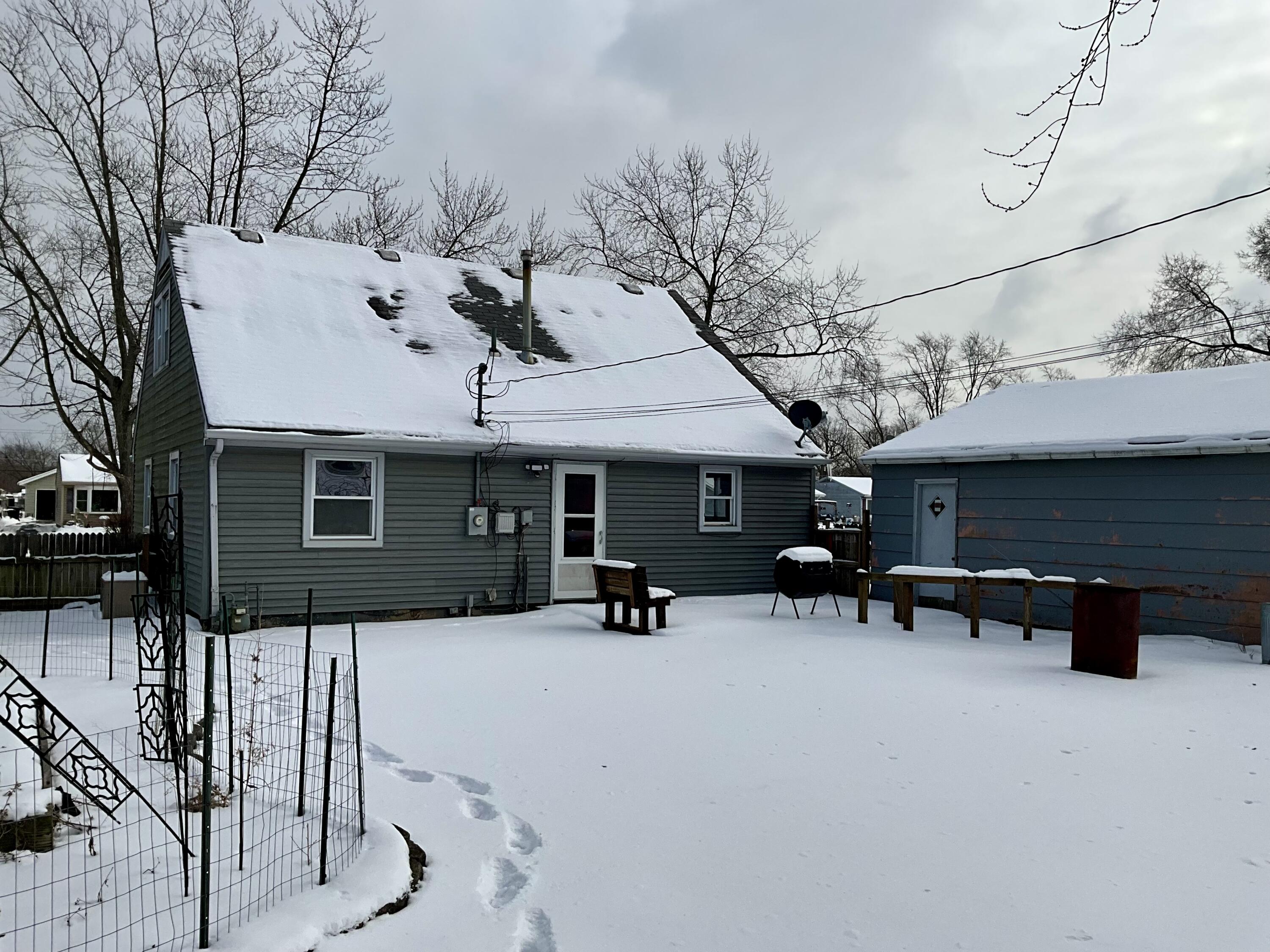 734-1 Juniper Road Valparaiso, IN 46385 - Photo 30 of 34 a view of a chairs and tables in the patio