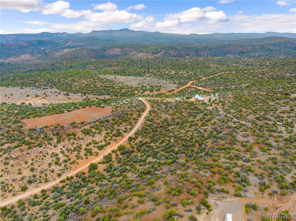 3894 North Lookout Canyon Road Kingman, AZ 86401 - Photo 47 of 64 Aerial view of sparsely populated area featuring a mountain backdrop