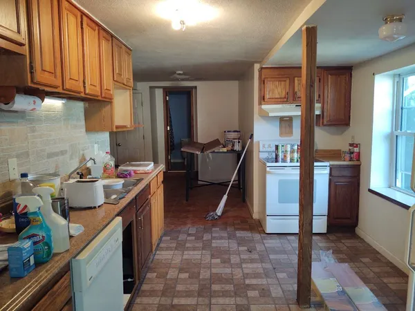 a kitchen with sink cabinets and outdoor view