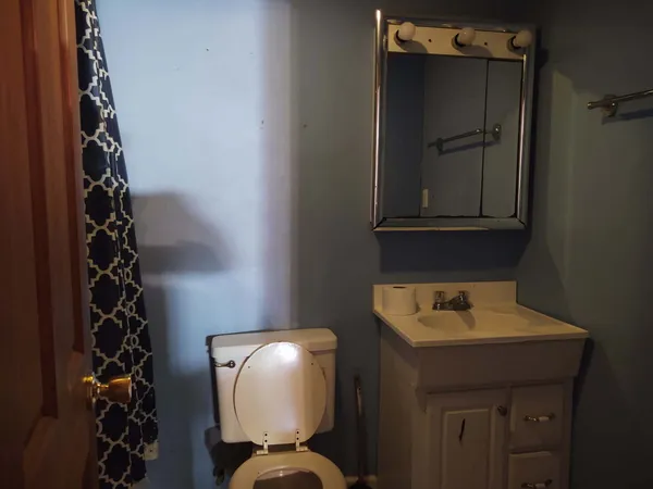 a bathroom with a sink and mirror
