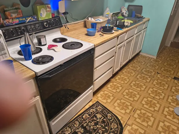 a kitchen with a stove and a sink