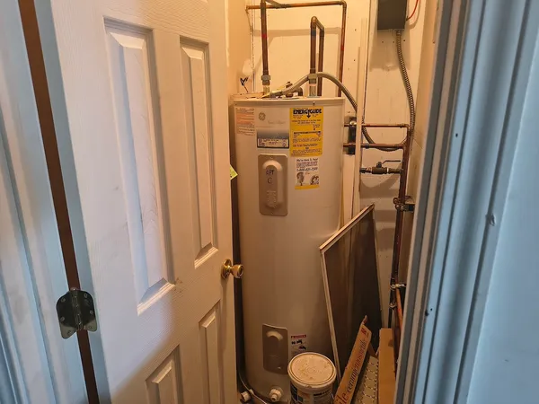 a bathroom with a shower a sink and toilet