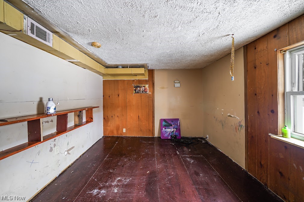 9606 Durst Colebrook Road North Bloomfield, OH 44450 - Photo 5 of 24 Unfurnished room featuring a textured ceiling