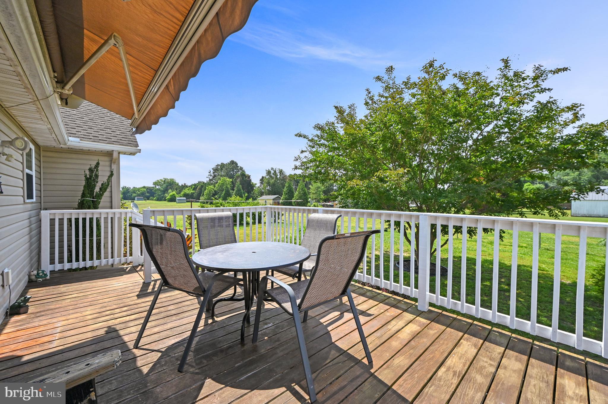 11684 Kensington Way Laurel, DE 19956 - Photo 8 of 23 Comfortable deck with Sunsetter Awning