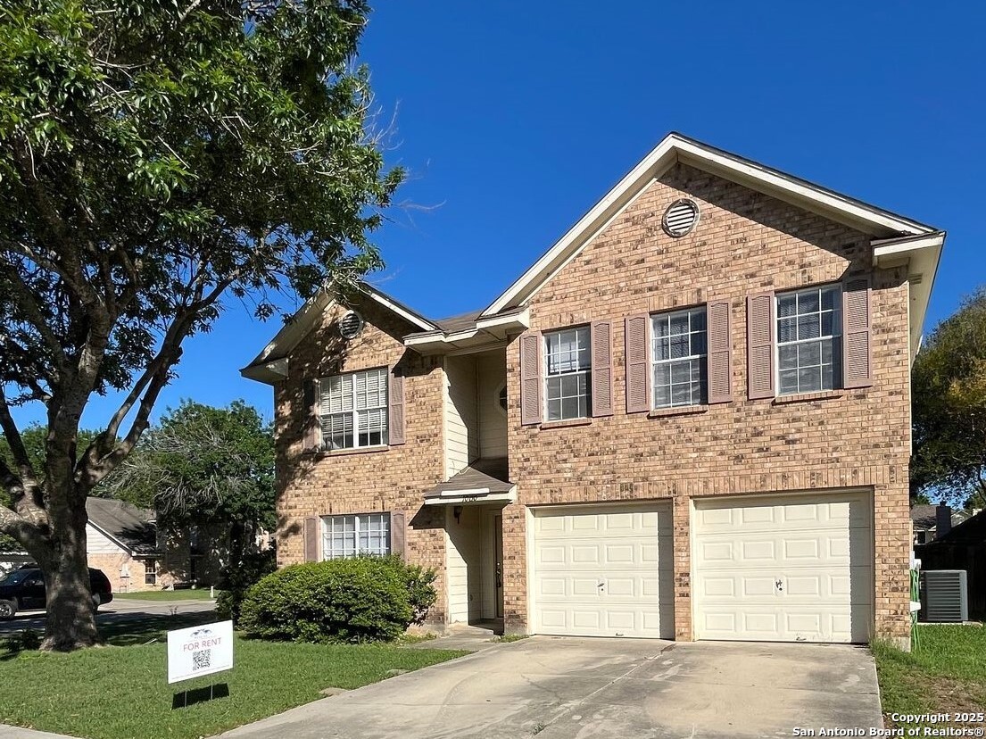 1000 White Wing Schertz, TX 78154 - Photo 1 of 1 a front view of a house with a yard and garage