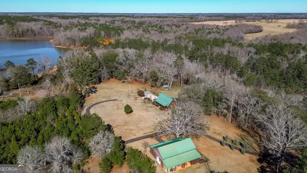 an aerial view of a house with a yard