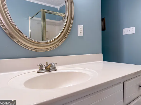 a bathroom with a sink and a mirror