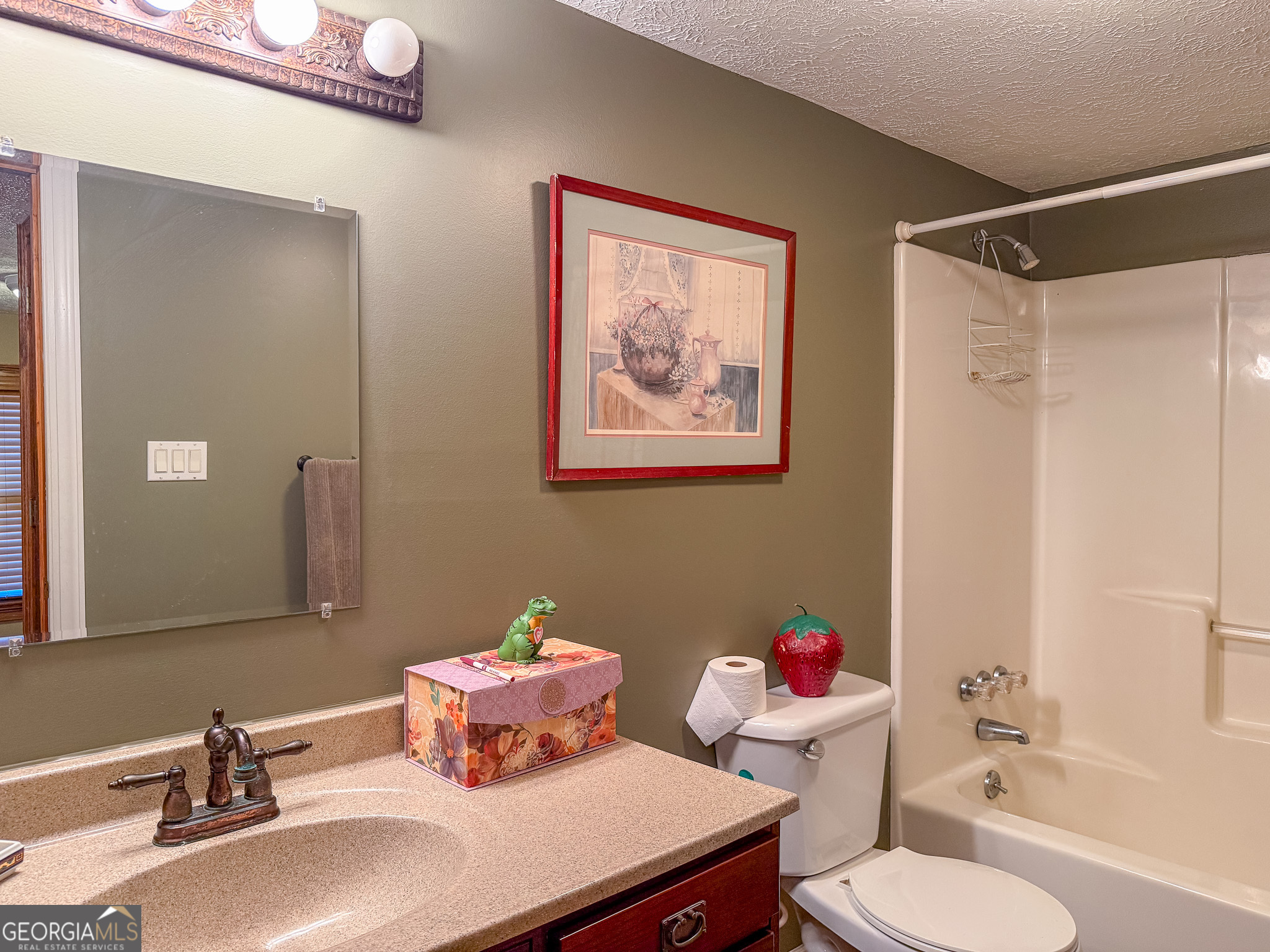 1003 Highway 27 Americus, GA 31709 - Photo 16 of 35 a bathroom with a sink mirror and toilet