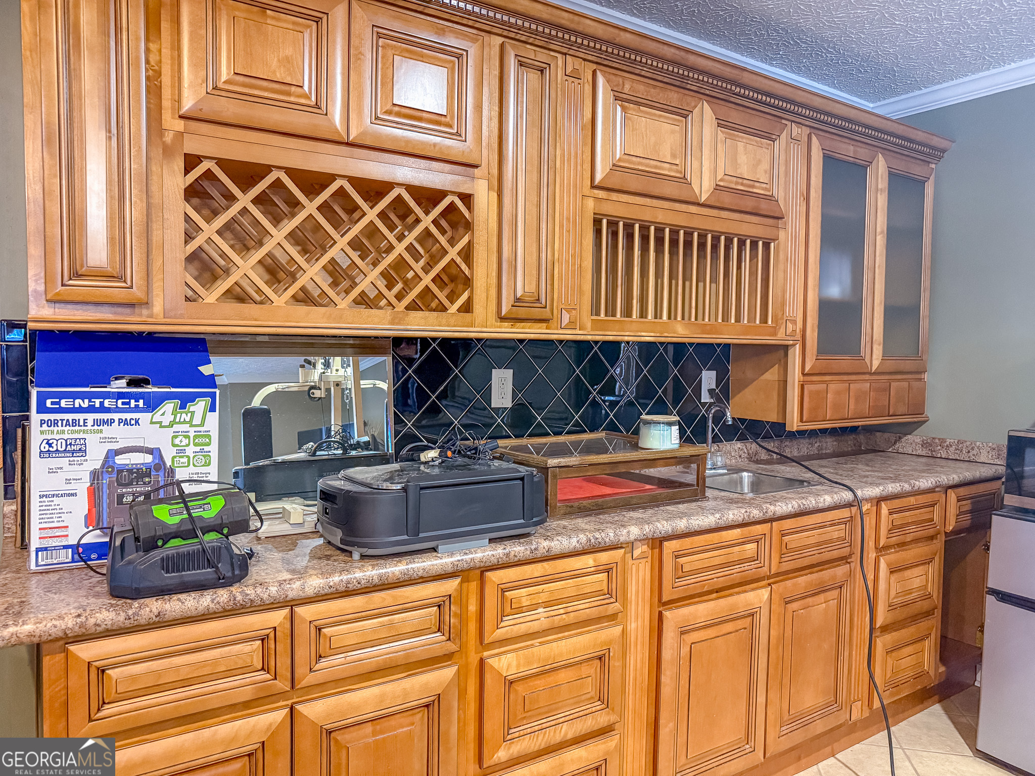 1003 Highway 27 Americus, GA 31709 - Photo 21 of 48 a kitchen with stainless steel appliances granite countertop a sink and cabinets