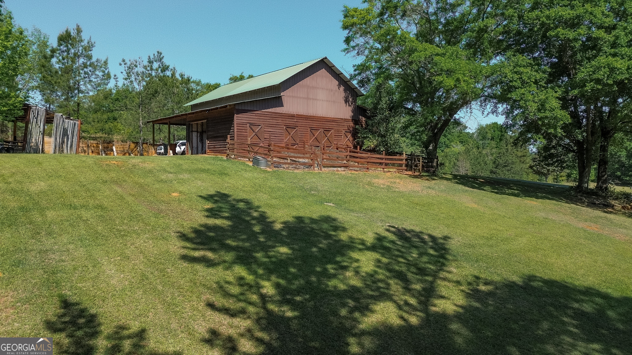 1003 Highway 27 Americus, GA 31709 - Photo 7 of 48 a front view of a house with yard and green space