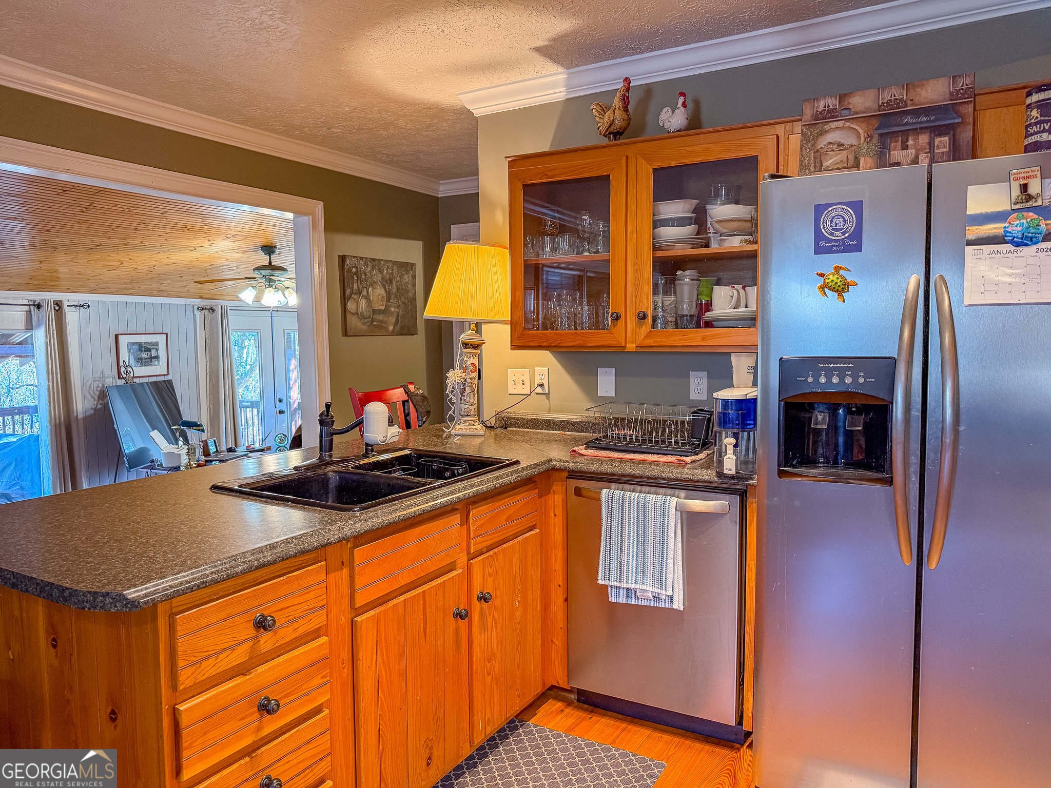 1003 Highway 27 Americus, GA 31709 - Photo 7 of 35 a kitchen with stainless steel appliances granite countertop a sink and a refrigerator