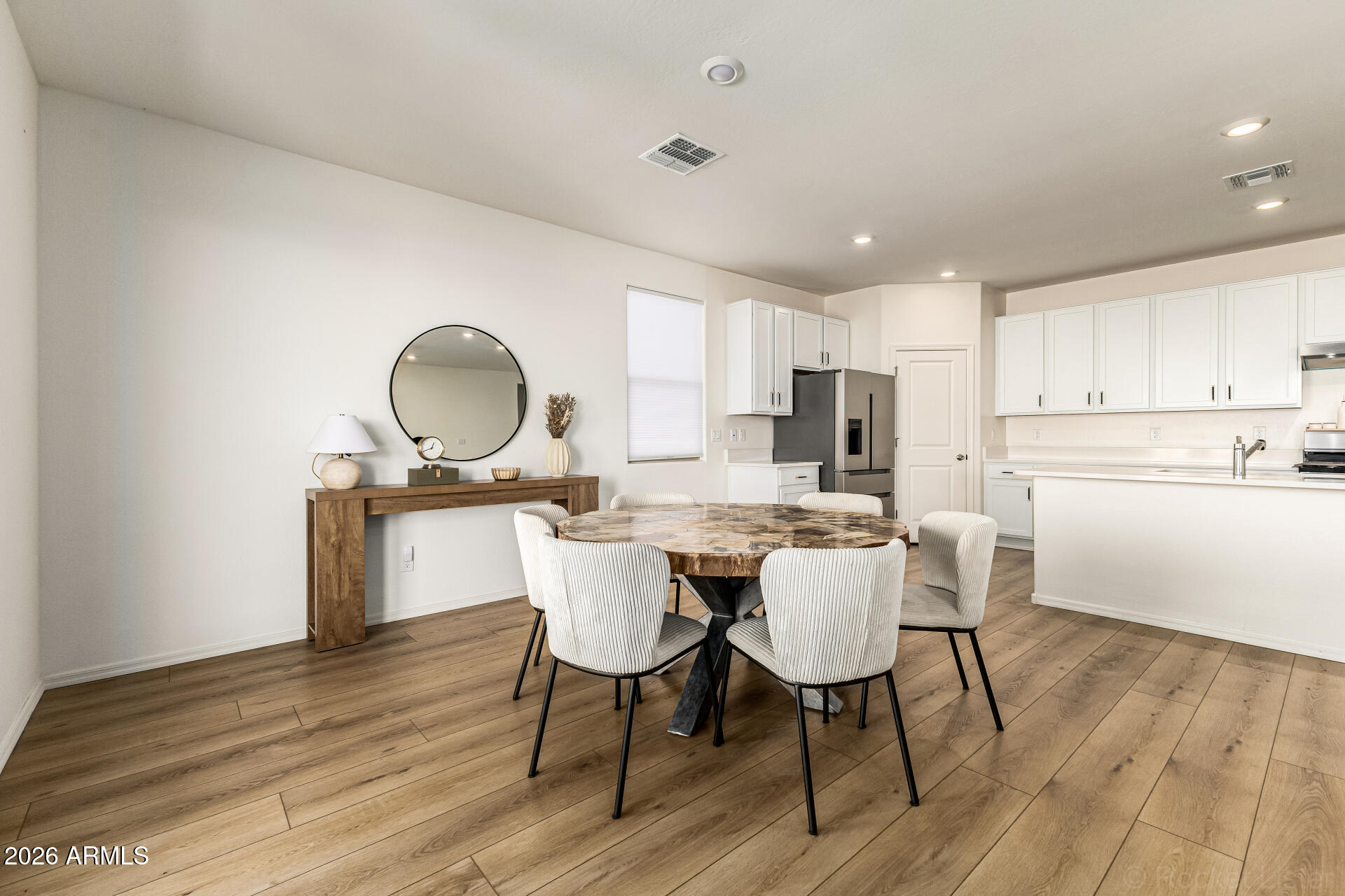 3022 West Estes Way Laveen, AZ 85339 - Photo 11 of 37 a view of a dining room with furniture and wooden floor