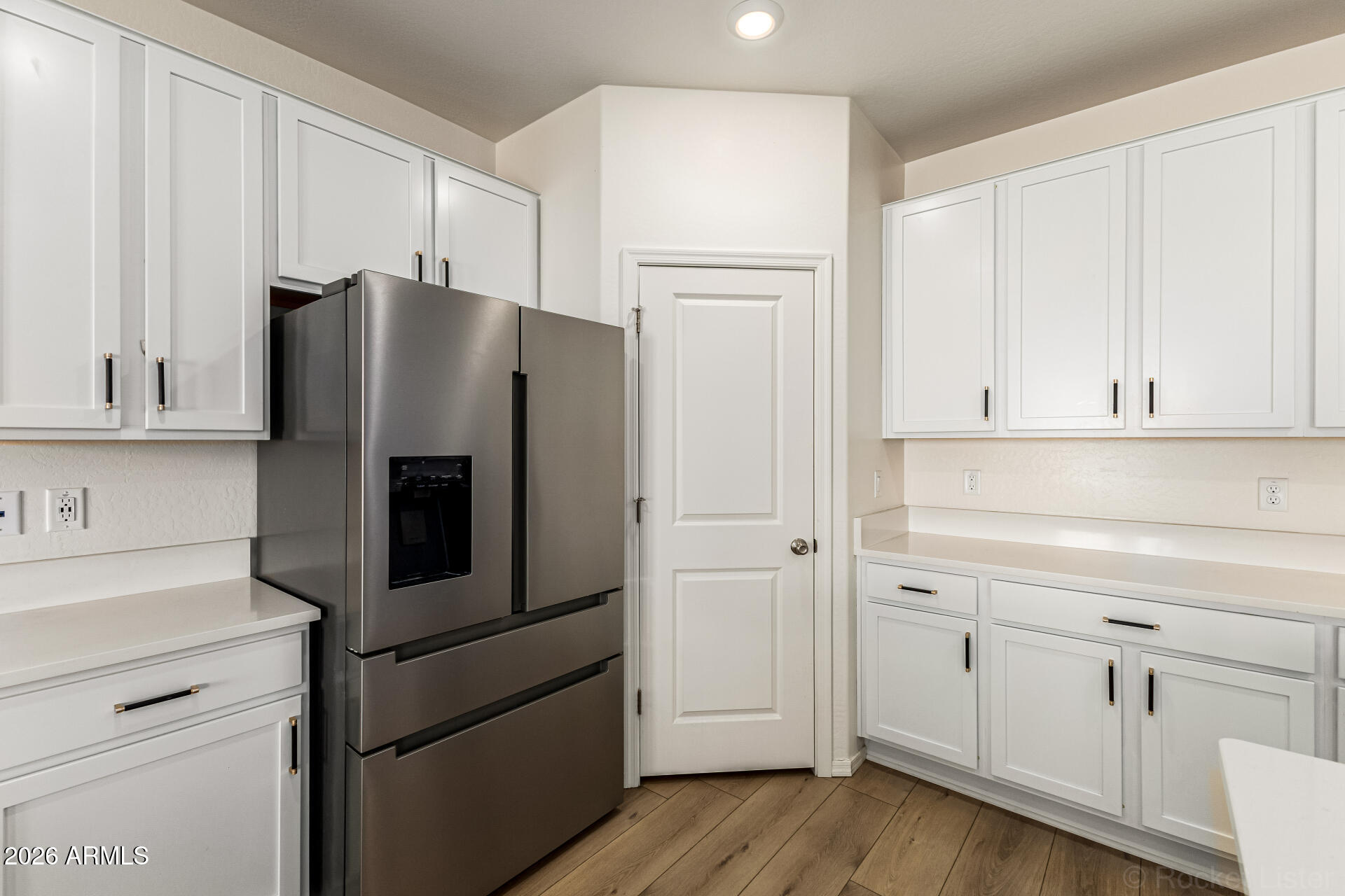 3022 West Estes Way Laveen, AZ 85339 - Photo 15 of 37 a kitchen with stainless steel appliances white cabinets and a refrigerator