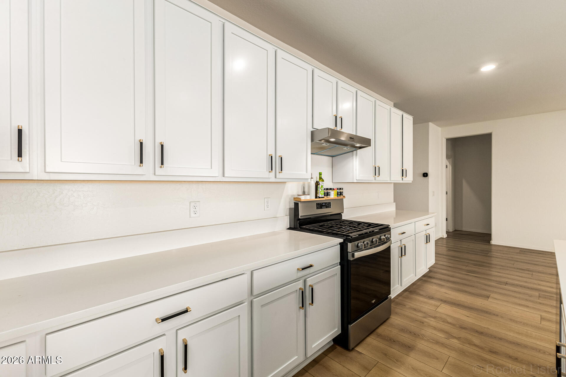3022 West Estes Way Laveen, AZ 85339 - Photo 16 of 37 a kitchen with stainless steel appliances a stove a sink and cabinets
