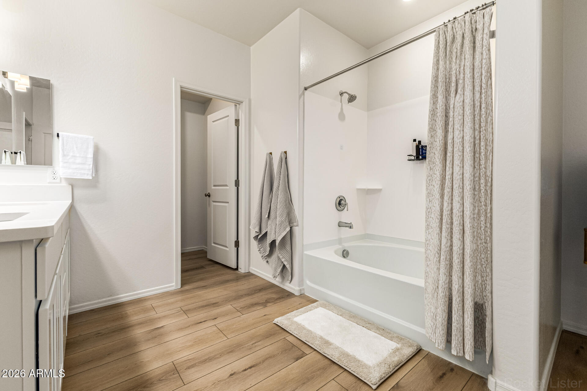 3022 West Estes Way Laveen, AZ 85339 - Photo 23 of 37 a bathroom with a bathtub a sink and a shower