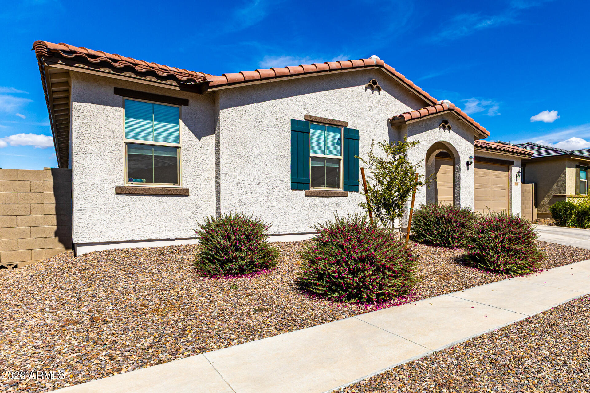 3022 West Estes Way Laveen, AZ 85339 - Photo 6 of 37 a front view of a house with garden