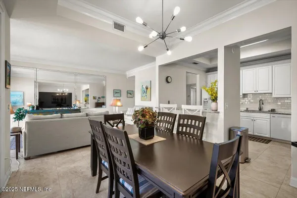 a view of a dining room with furniture and a livingroom