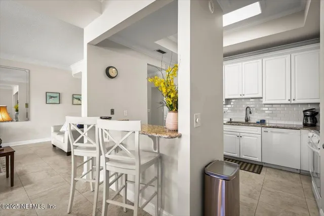 a view of kitchen with cabinets and wooden floor