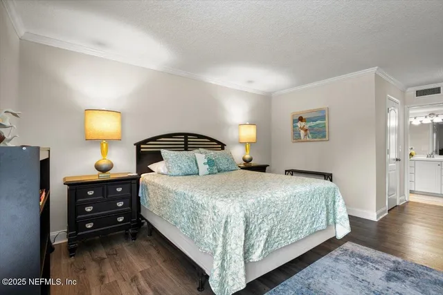 a bedroom with a bed and a lamp