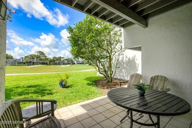 a view of yard from deck having patio