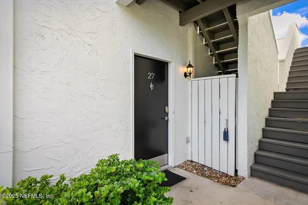 a view of a house with a wooden door