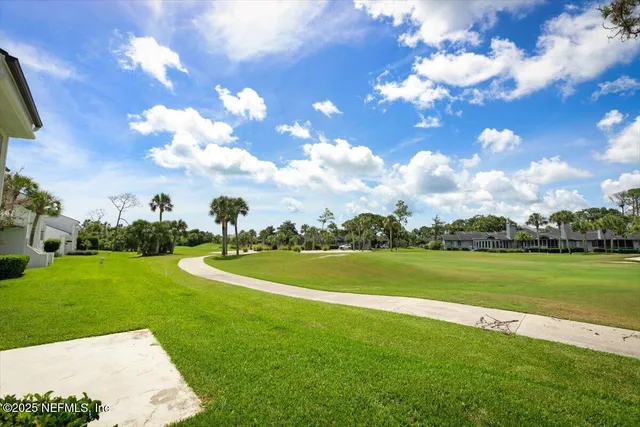 a view of a golf course with a lake