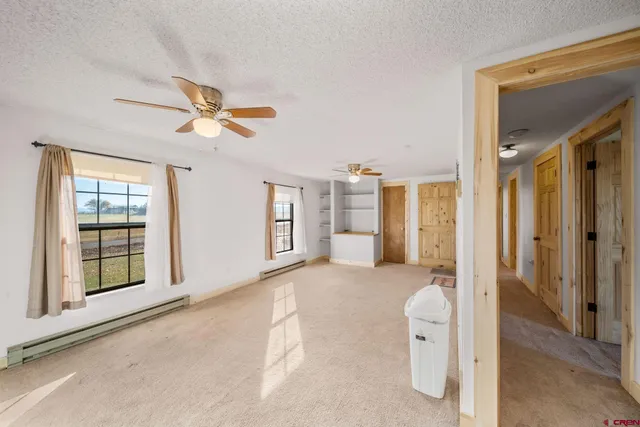 a view of livingroom with furniture and windows
