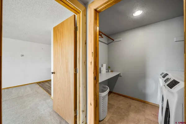 a view of hallway with washer and dryer