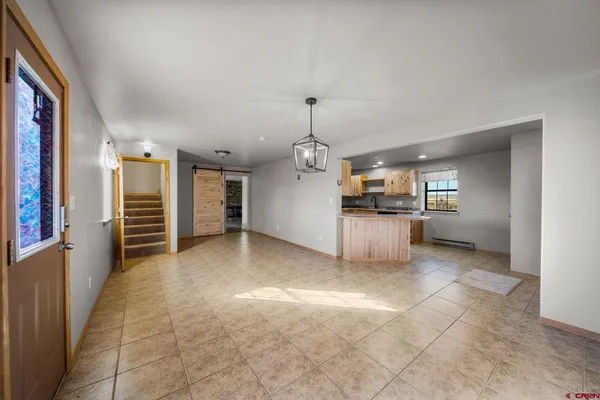 a view of a kitchen with furniture and a kitchen