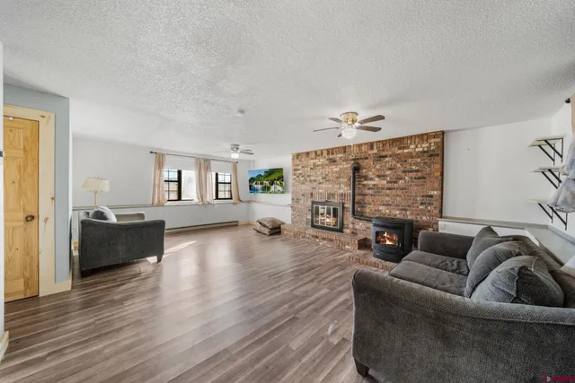 a living room with furniture and a fireplace