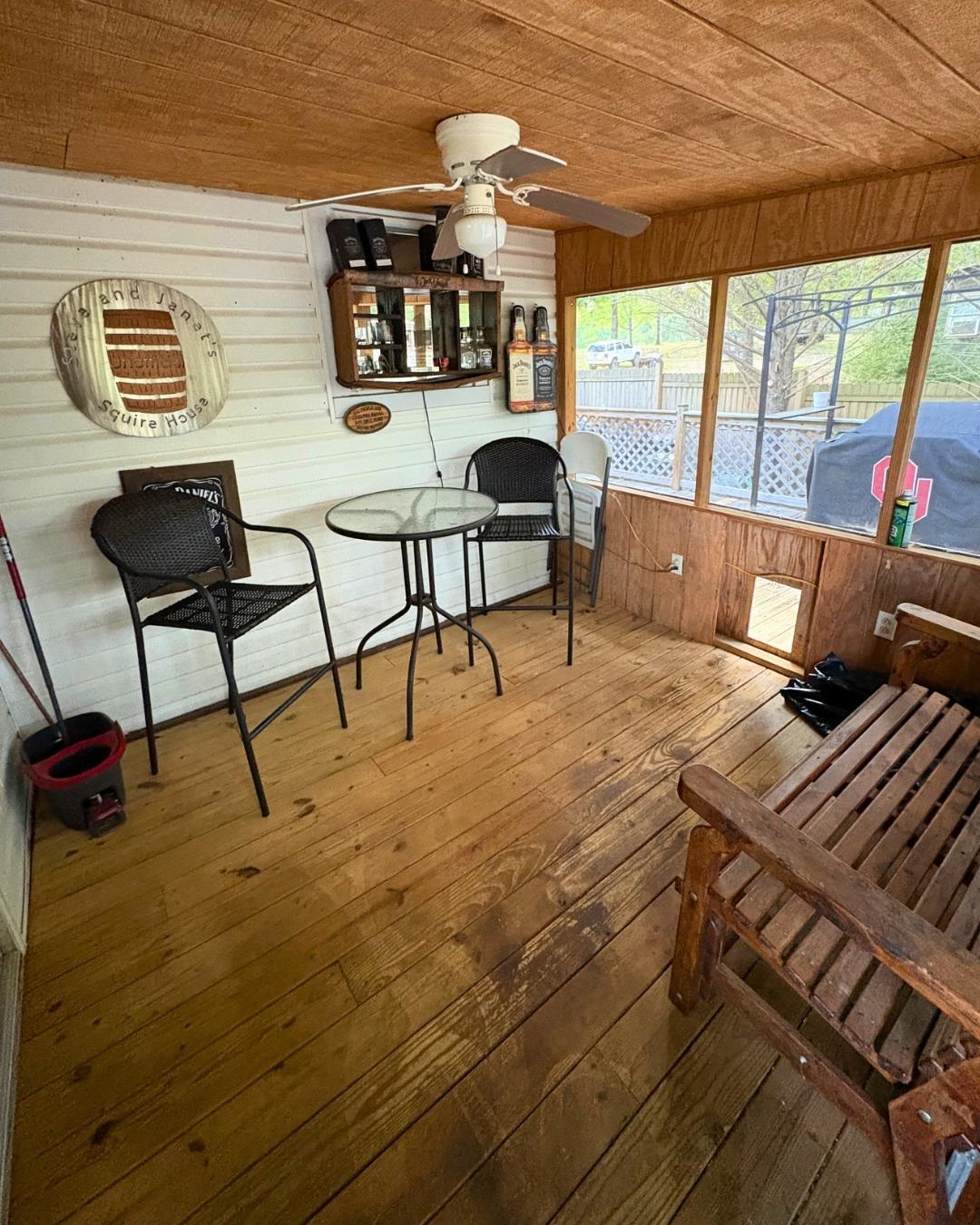 772 Rushing Road Michie, TN 38357 - Photo 7 of 19 Screened porch featuring wood-finish flooring, wood-paneled ceiling, and a ceiling fan