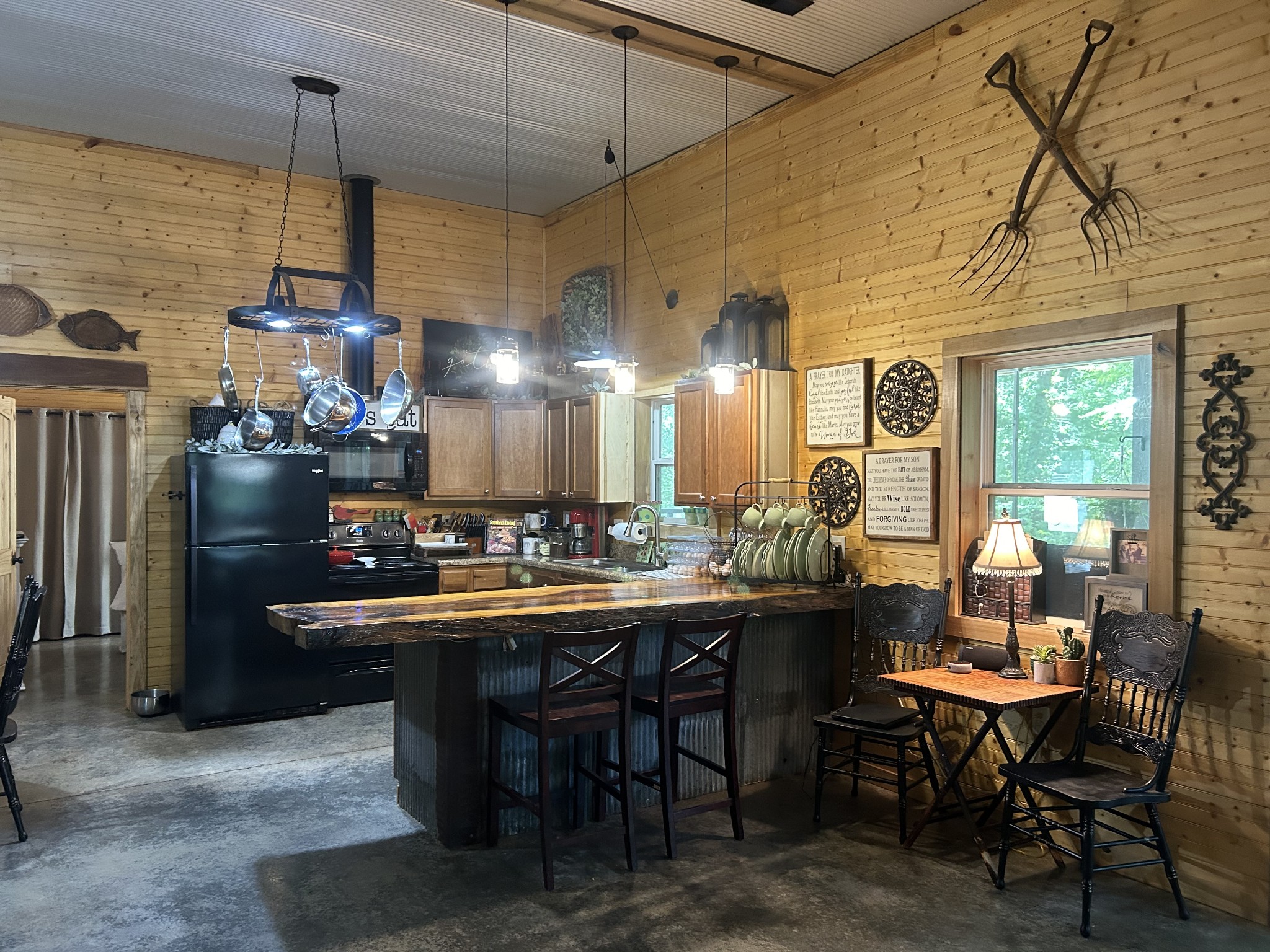5013 Eva Road Camden, TN 38320 - Photo 3 of 37 a kitchen with a dining table and chairs