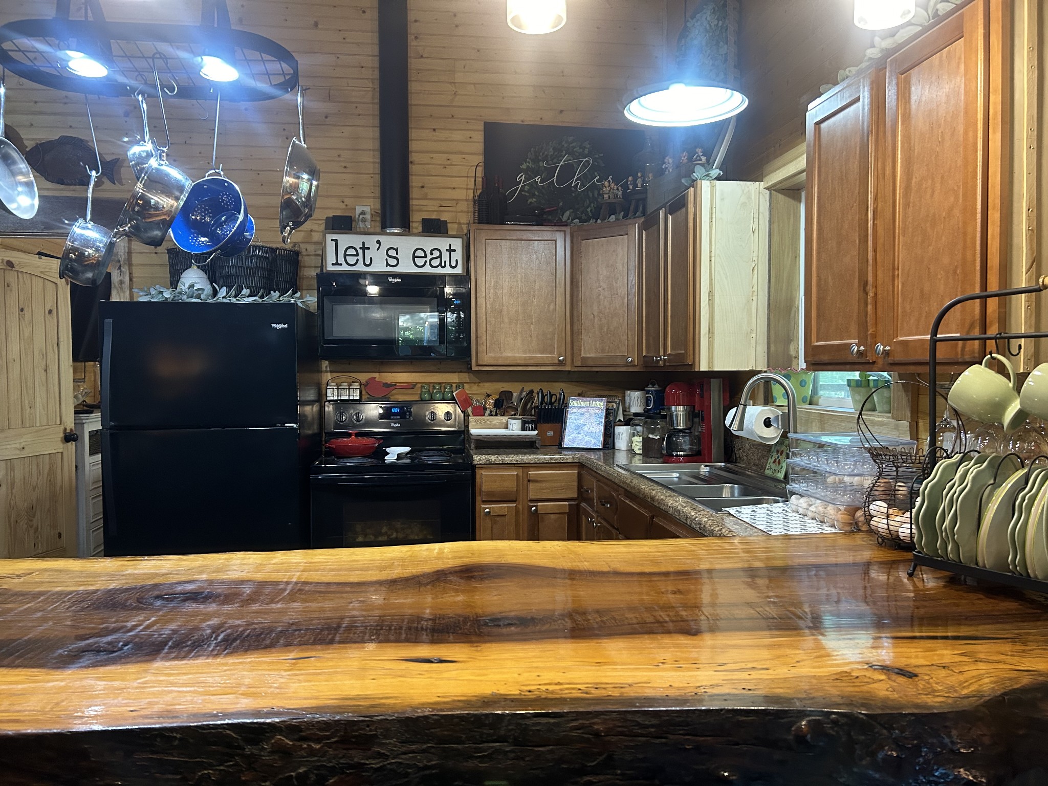 5013 Eva Road Camden, TN 38320 - Photo 5 of 37 a kitchen with stainless steel appliances granite countertop a sink stove and refrigerator
