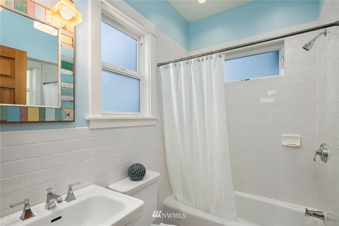 112 North 58th Street Seattle, WA 98103 - Photo 13 of 27 a bathroom with a sink and shower