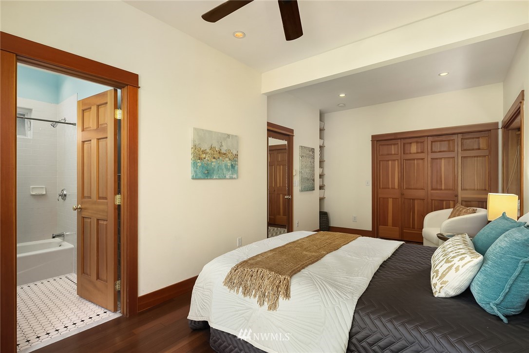112 North 58th Street Seattle, WA 98103 - Photo 14 of 27 a bedroom with a bed and a window