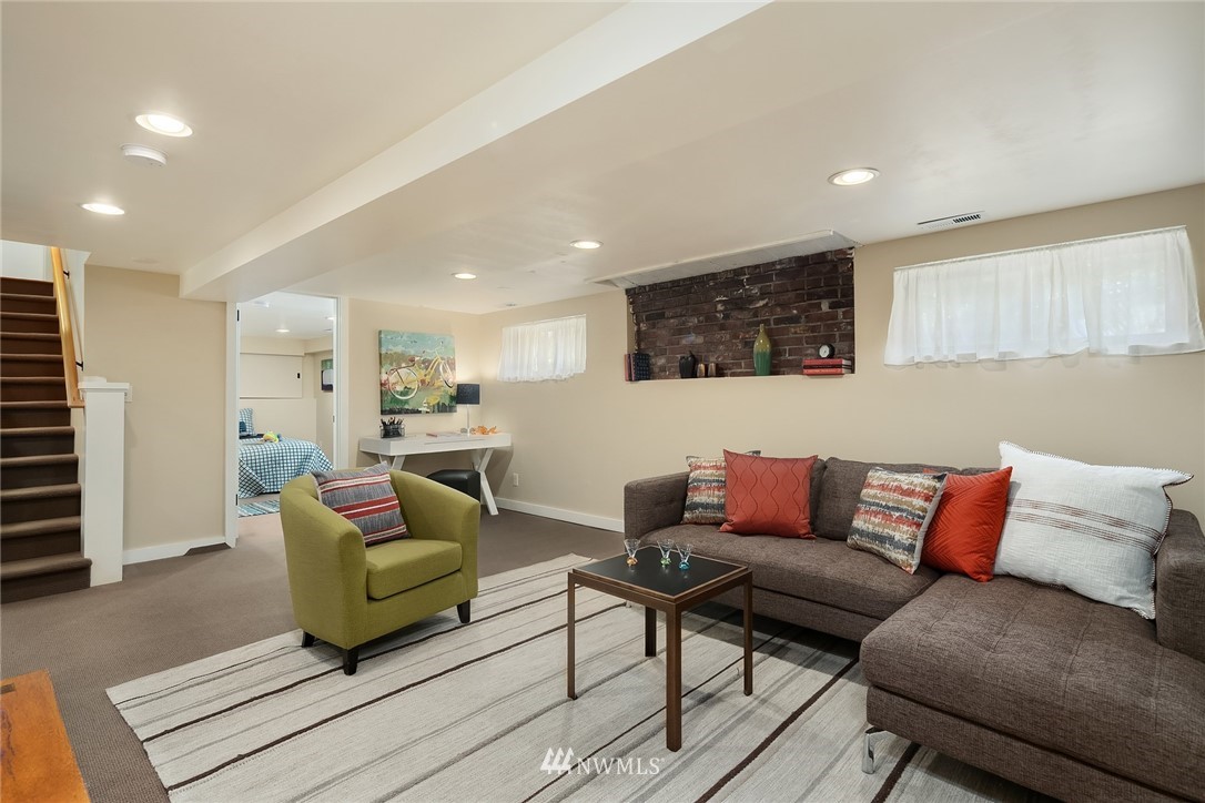 112 North 58th Street Seattle, WA 98103 - Photo 18 of 27 a living room with furniture and a couch