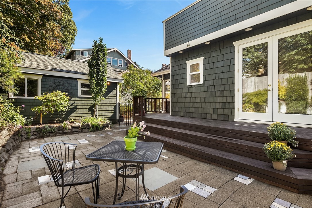 112 North 58th Street Seattle, WA 98103 - Photo 23 of 27 a view of a house with backyard and sitting area