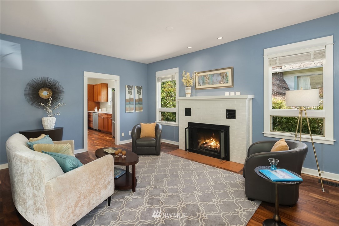 112 North 58th Street Seattle, WA 98103 - Photo 4 of 27 a living room with furniture and a fireplace
