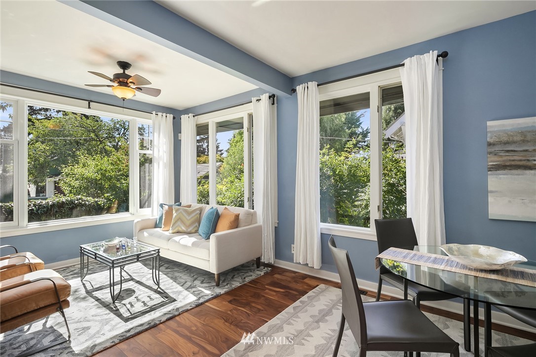 112 North 58th Street Seattle, WA 98103 - Photo 6 of 27 a living room with furniture and a large window