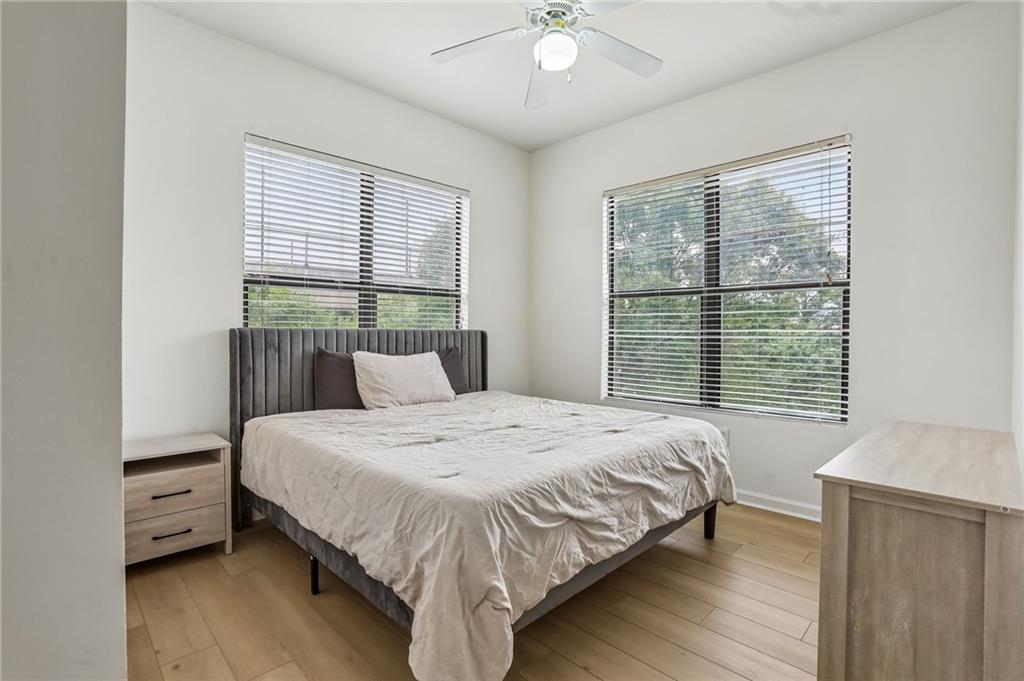 5300 Peachtree Road, Unit 3506 Atlanta, GA 30341 - Photo 8 of 25 a bedroom with a large bed and a window