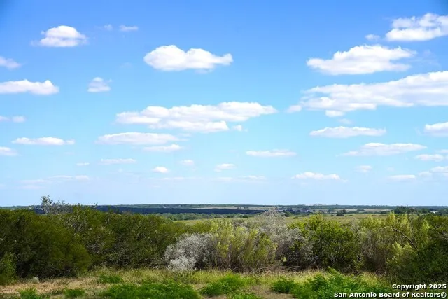 a view of a road with mountains in the background