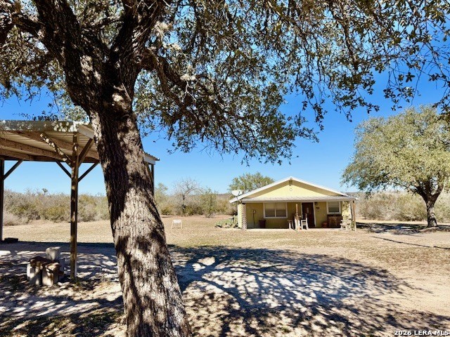 731 Cr 325 George West, TX 78022 - Photo 17 of 37 a front view of a house with a yard