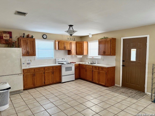 731 Cr 325 George West, TX 78022 - Photo 27 of 37 a large kitchen with a stove a sink dishwasher and a refrigerator