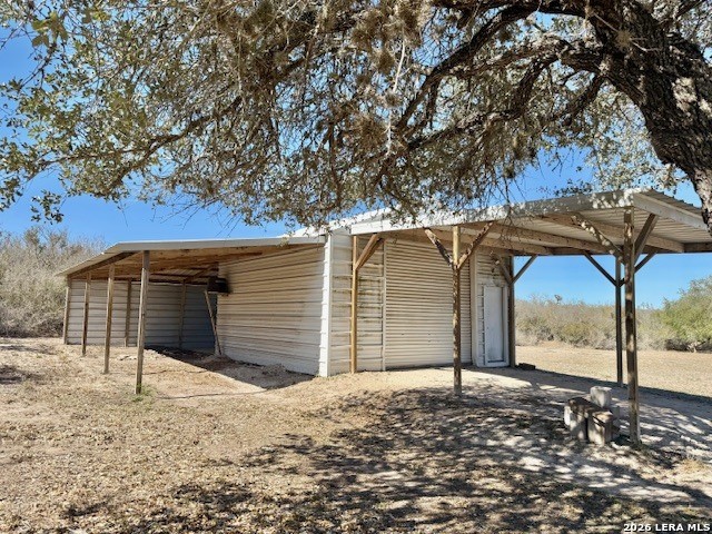 731 Cr 325 George West, TX 78022 - Photo 35 of 37 a front view of a house with a yard and garage