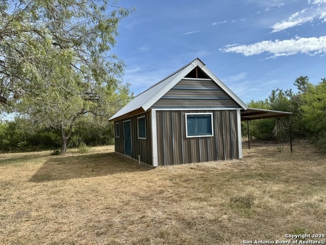 731 Cr 325 George West, TX 78022 - Photo 10 of 37 a front view of a house with a yard
