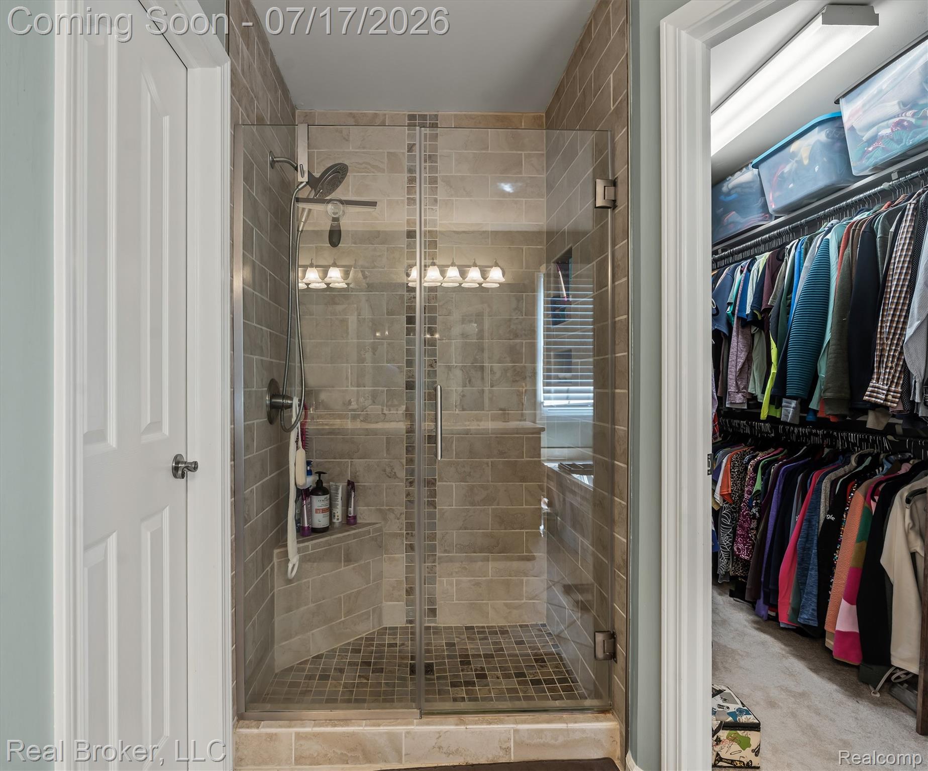 45192 Thornhill Road Canton, MI 48188 - Photo 17 of 34 Glass-enclosed shower with tiled walls and floor, built-in bench, and wall-mounted showerhead
