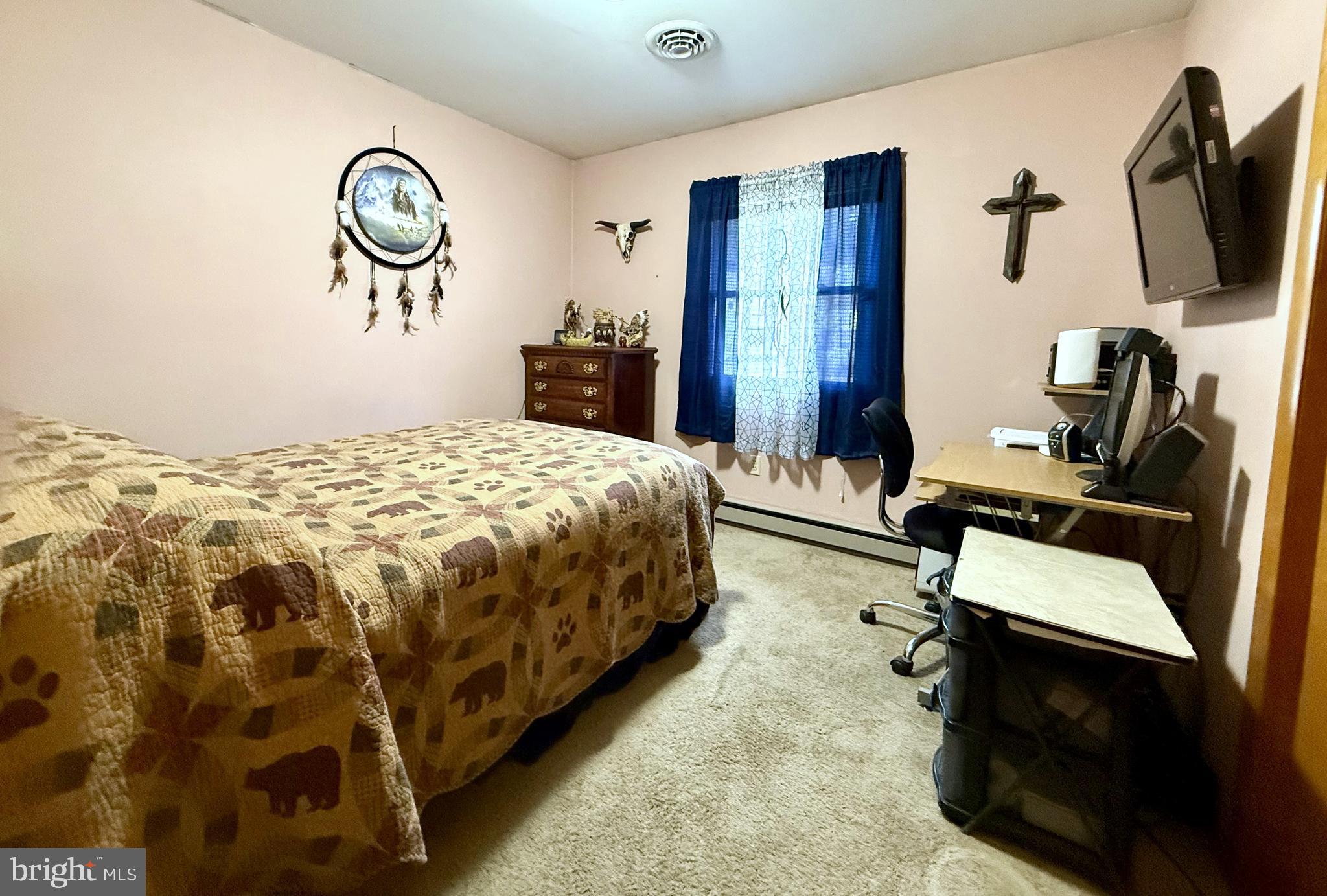 42 Linnet Drive Lock Haven, PA 17745 - Photo 16 of 40 a bedroom with a bed and a flat screen tv