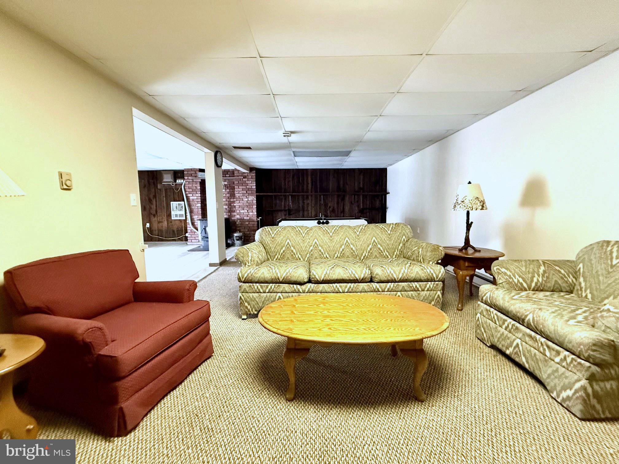 42 Linnet Drive Lock Haven, PA 17745 - Photo 19 of 40 a living room with furniture a chandelier and a rug