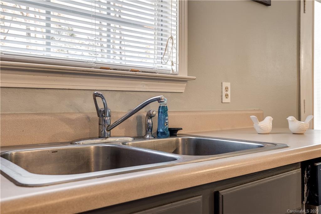 8808 Old Potters Road Charlotte, NC 28269 - Photo 14 of 34 a close view of sink and tap