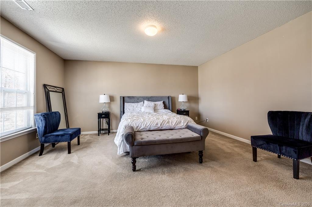 8808 Old Potters Road Charlotte, NC 28269 - Photo 21 of 34 a bedroom with a bed chair and a couch